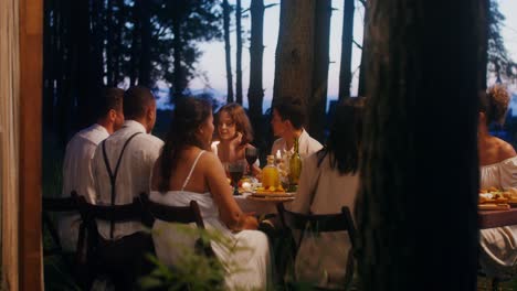 friends dinner in a forest