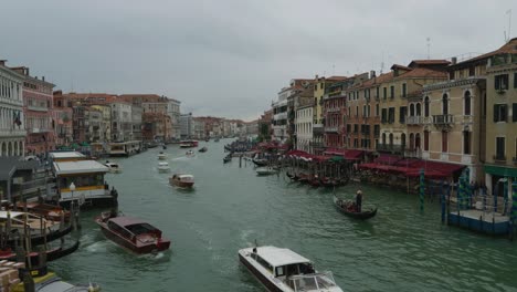 Busy traffic on Venice Grand Canal with boats passing through