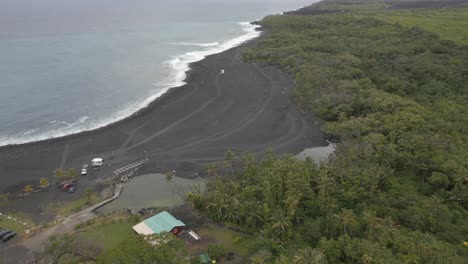 flat light flyover of ash mounds at pohoiki bay hot springs, hawaii