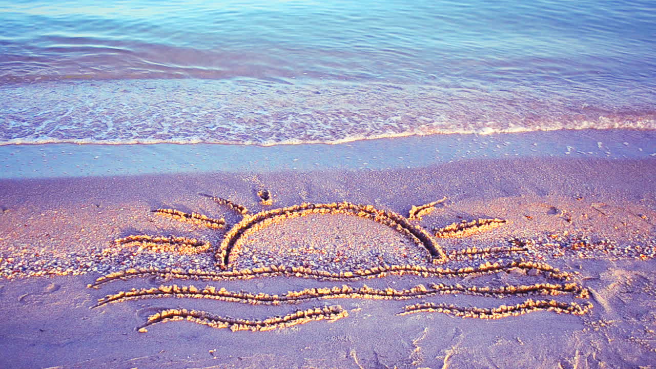 Sun drawing on the beach. Beach and drawing