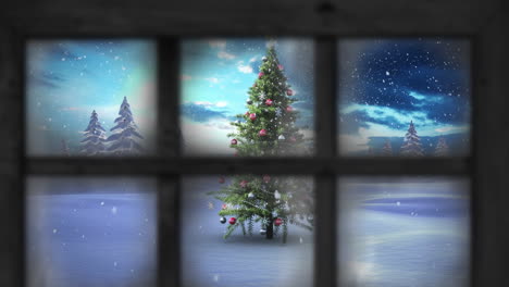 animación de nieve cayendo sobre el árbol de navidad y paisaje de invierno visto a través de la ventana