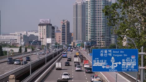 Lots-of-cars-and-heavy-traffic-driving-on-highway-in-Seoul-city,-South-Korea