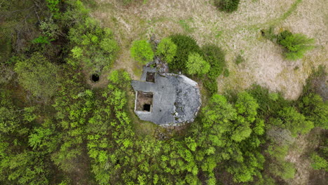 Top-View-Of-An-Old-Military-German-Bunker-In-The-Dense-Forest-Of-Tromso,-Norway