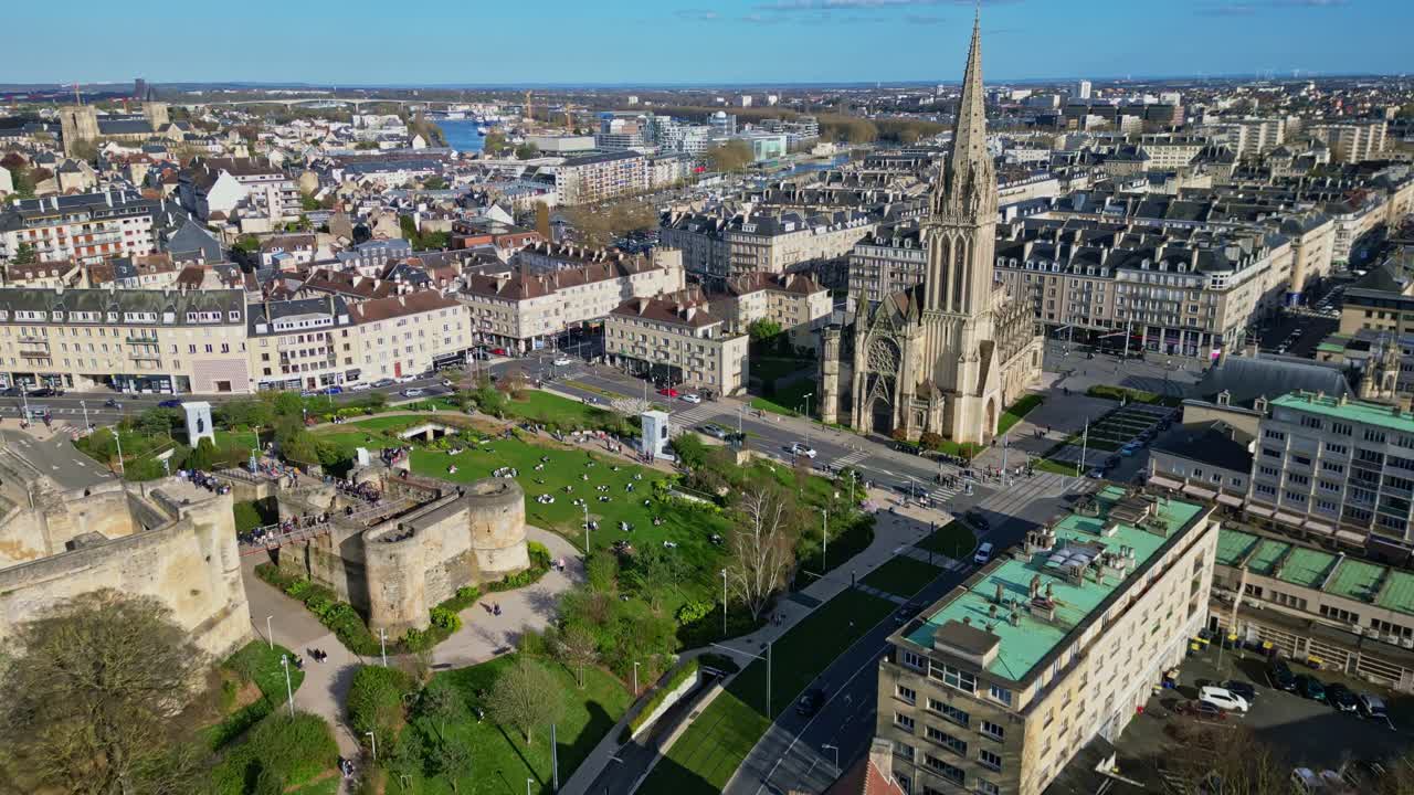 Historic Chateau de Caen and prominent Église Saint-Pierre church in Caen, Normandy. Highlights key landmarks, ideal for travel, history. France. Aerial