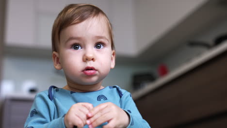 baby playing in kitchen