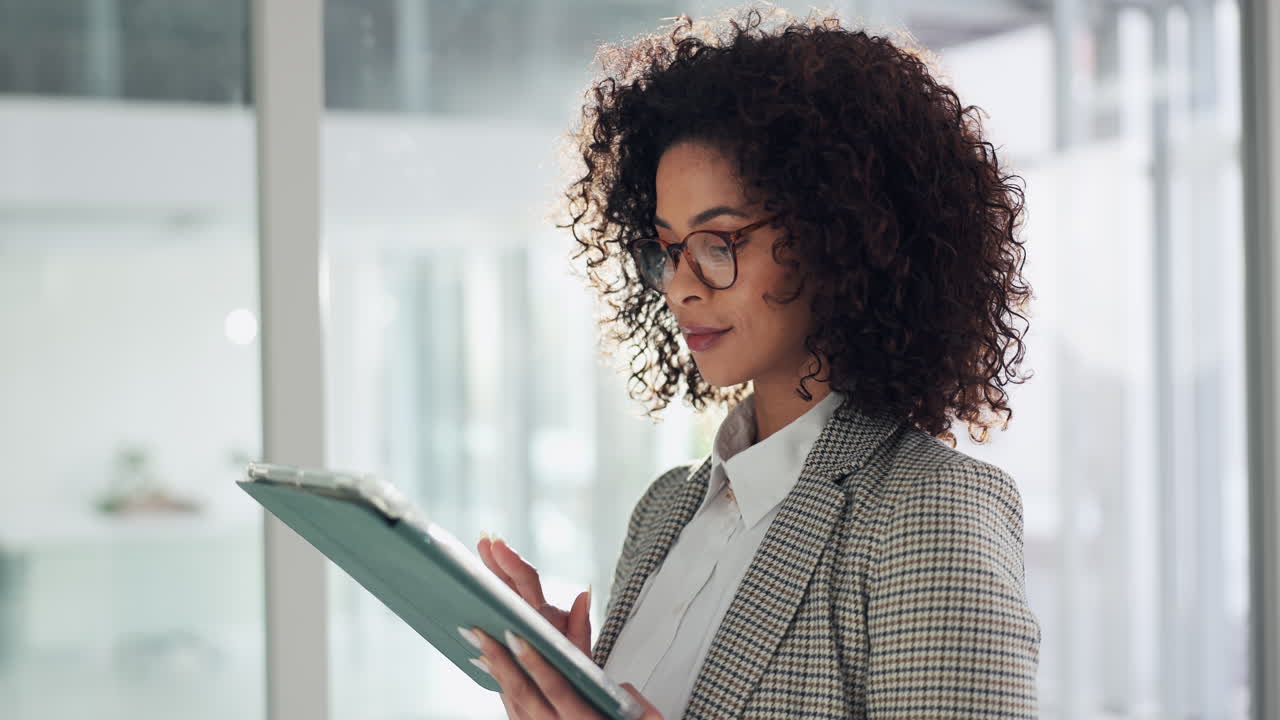 Businesswoman working on tablet in office