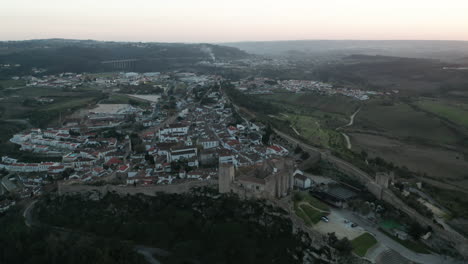 aerial view of medieval town of obidos in portugal during daytime - aerial drone shot