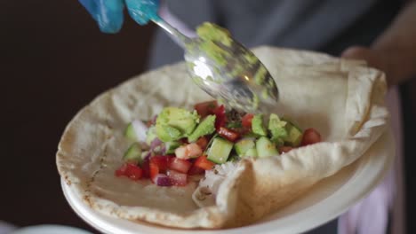 avocado served into tasty veg flatbread dish