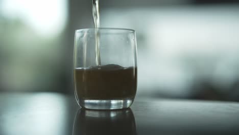 Pouring-Beer-Into-The-Glass-On-The-Table