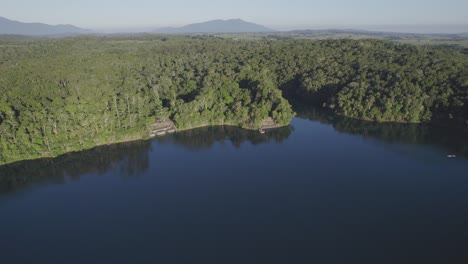 tranquil scenery at lake eacham in atherton tableland of queensland, australia - aerial drone shot