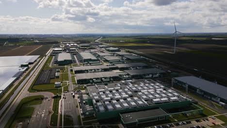 drone footage showing the scale and symmetry of a massive data center and energy facility in middenmeer, the netherlands