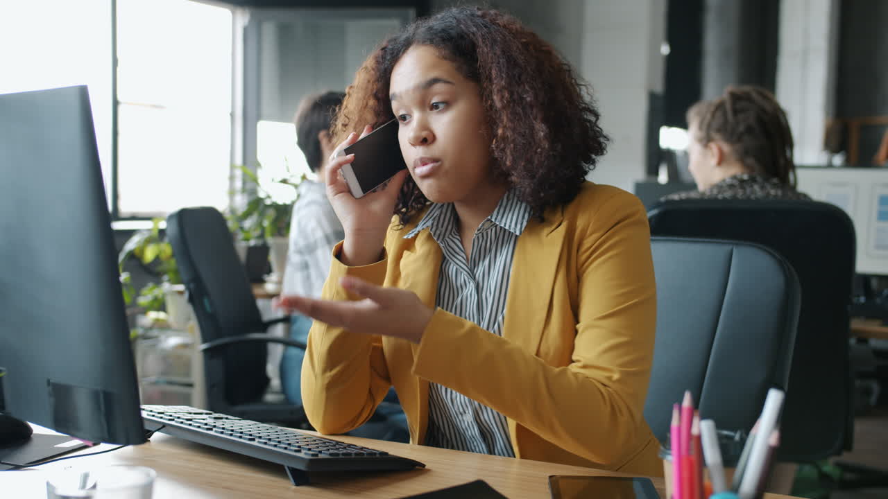 Woman on phone in office