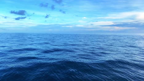 slow paning clip over the ocean with beautiful teal colors of the sky and the clouds in the background in the area of florida keys in usa