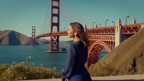 a woman looks out at the golden gate bridge in san francisco