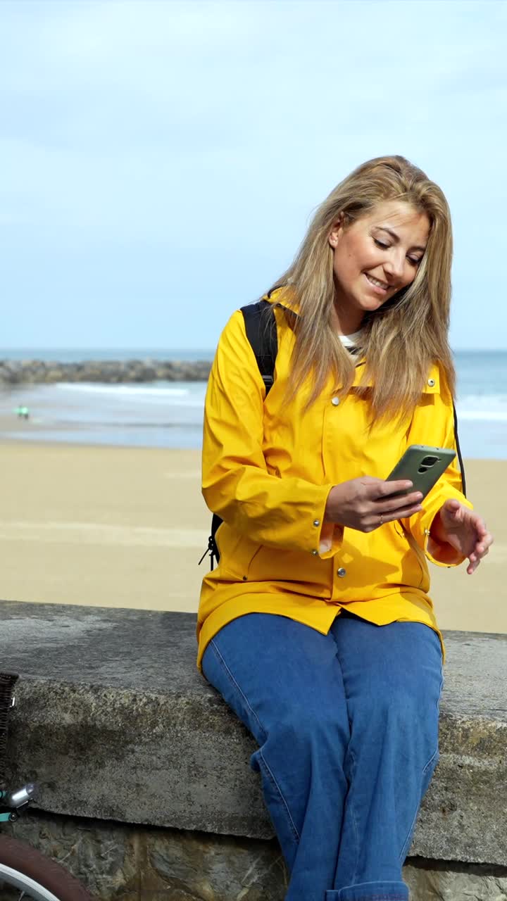 Woman taking a selfie at the beach
