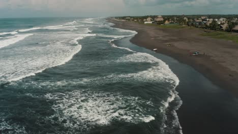 el paredon surfing beach in guatemala on a cloudy day - drone shot