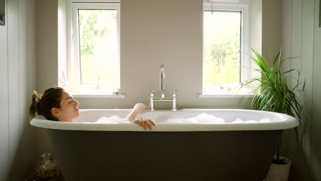 woman, bathtub and relax in bathroom home