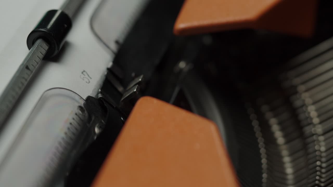 Close-up of Hand Typing '5%' on Vintage Typewriter
