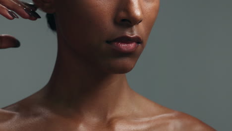 hands touch, skincare and lips of woman in studio