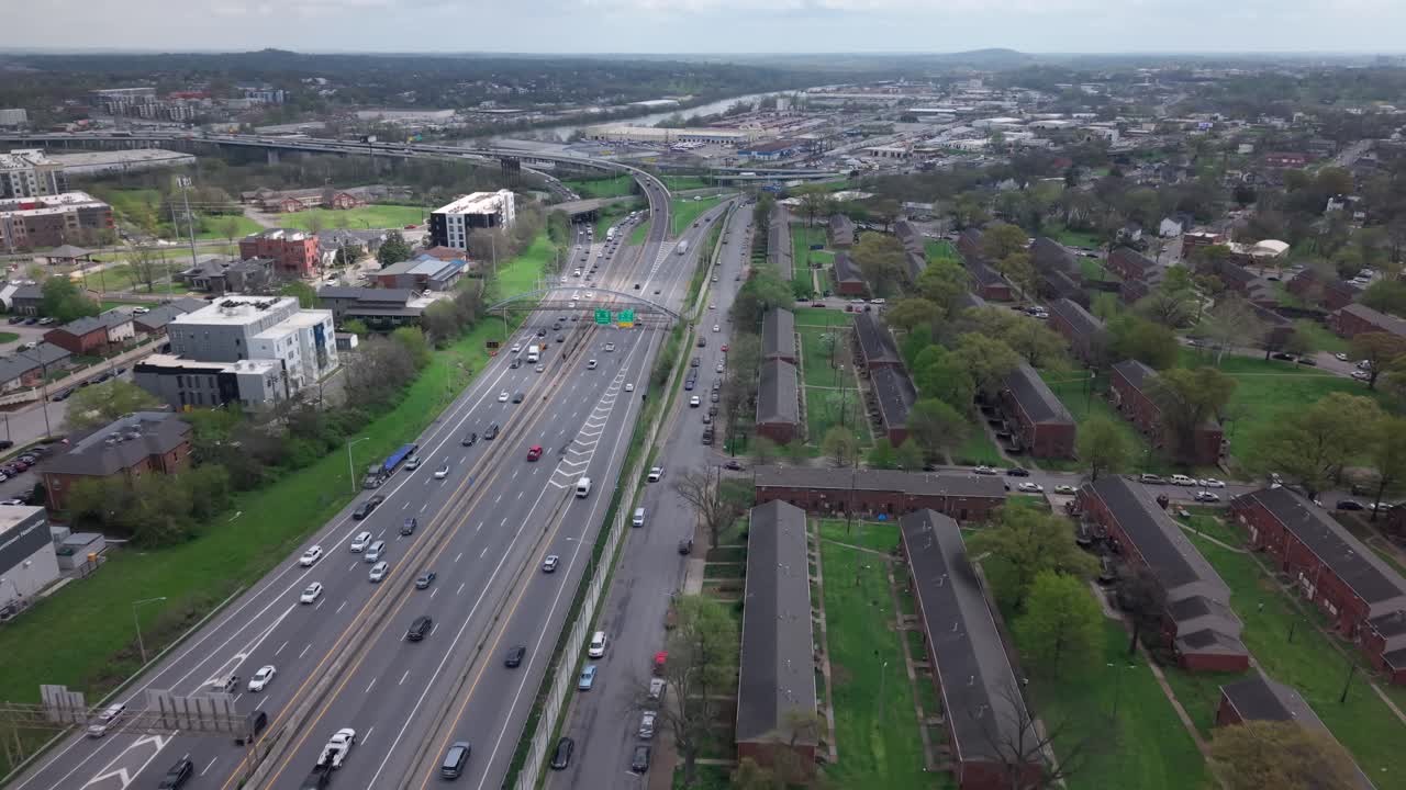 Aerial flyover over Interstate-40, also know as the Music Highway, in Nashville, Tennessee in daytime with light traffic