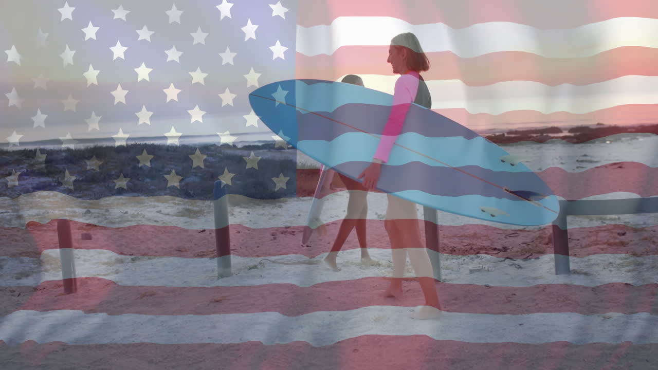 Animation of flag of usa over happy diverse women with surfboard on beach in summer