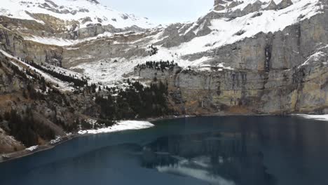 Oeschinensee-lake-and-mountain-Switzerland-4K-drone-footage