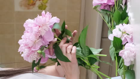 a young woman skillfully arranges beautiful flowers in a chic box in a floral design a young woman skillfully arranges beautiful flowers in a chic box showcasing her floral design creativity
