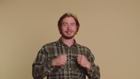 mime young adult man pulling an imaginary unreal invisible rope showing how enduring, strong he is