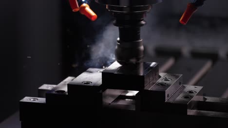 cnc machine cutting a piece of metal, steam