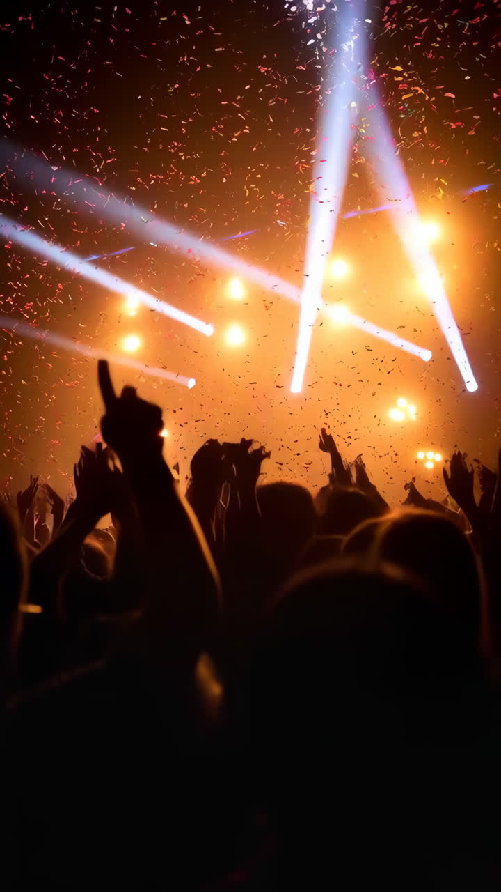 Vibrant Live Concert with Confetti and Stage Lights over Audience