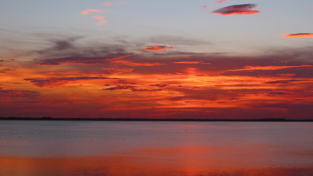 Stunning blue and pink sunset over the tranquil Banana River in Cocoa Beach, Florida. A serene, generic riverside scene perfect for themes of peace, nature, and beauty
