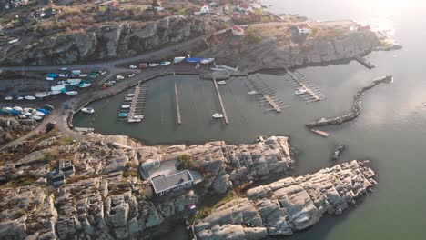 boat harbor marina in rocky cove on sweden's west coast, aerial