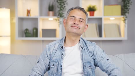 happy man waving at camera.