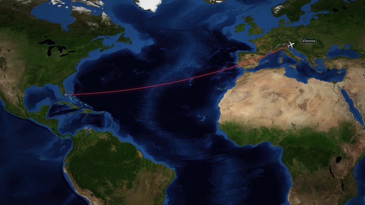 Satellite map animation tracks an airplane flying from Miami to Vienna across the Atlantic