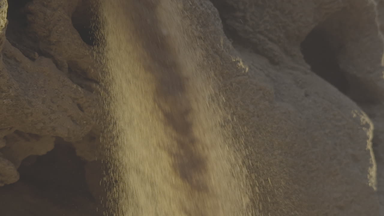 Sand pouring from a source