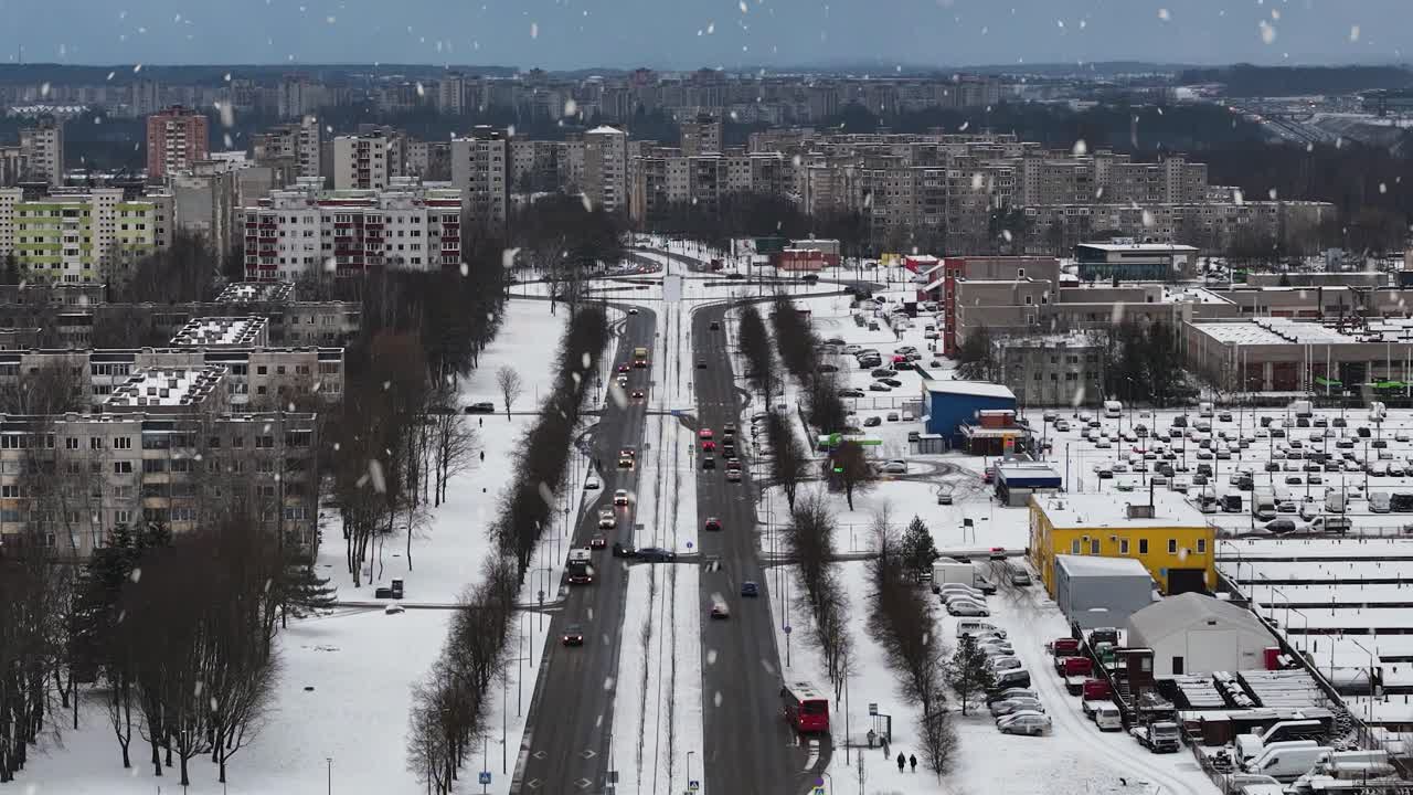 Snowfall in Kaunas suburbs, aerial drone view