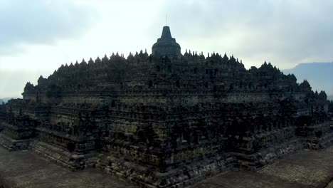 unique view of borobudur temple from bottom to top stupa, java indonesia aerial