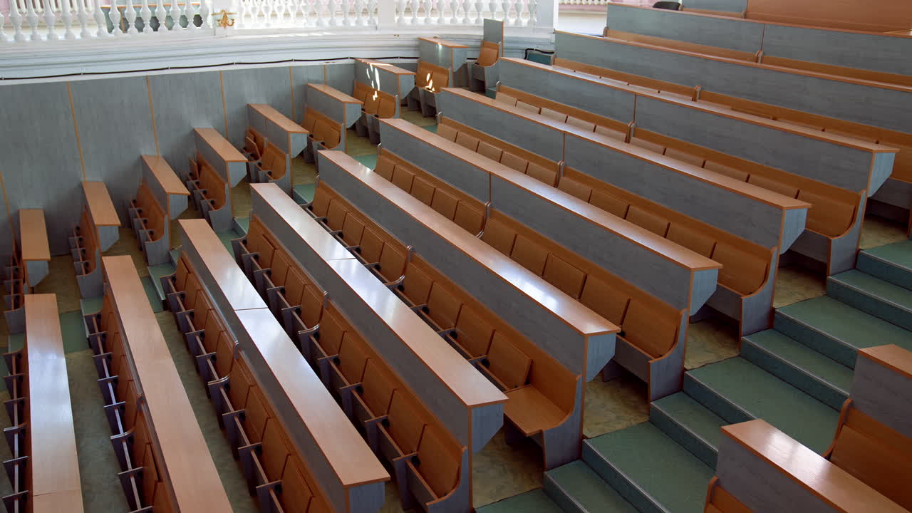 Shot of empty university classroom. Empty modern lecture style university classroom
