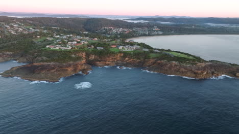 aerial: high up drone shot of tathra and the surrounding landscape on south coast nsw, australia