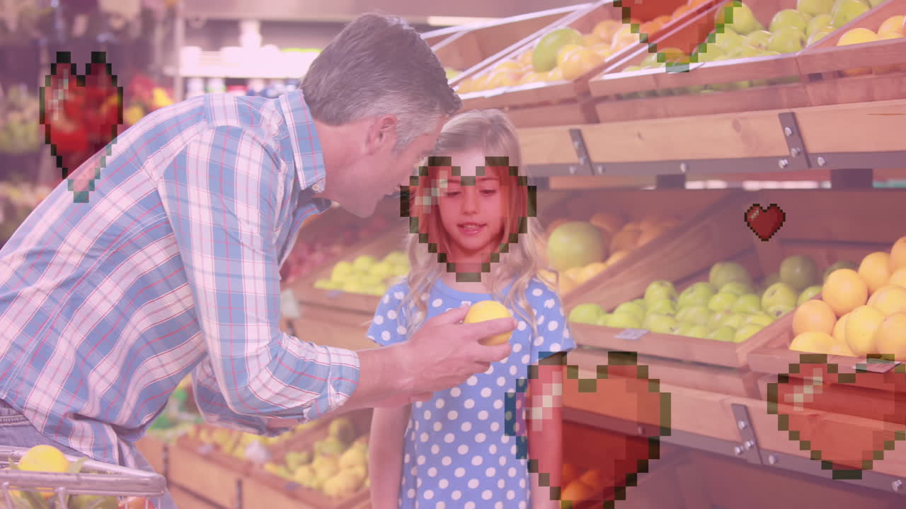 animación de iconos de corazón sobre padre caucásico con hija sosteniendo limón