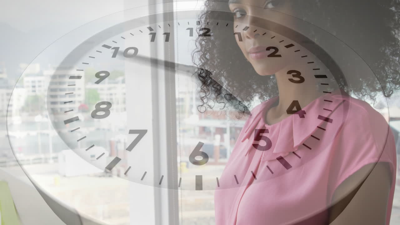 Clock animation over woman standing by window in office