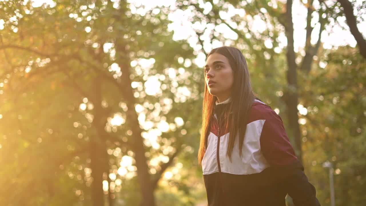 Woman exercising with dumbbell in the park