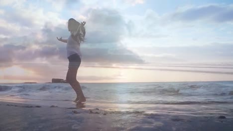 woman dancing by the beach