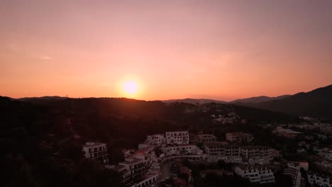 aerial view of a seaside town at sunset