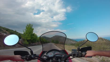 riding a motorcycle on penteli mountain in greece