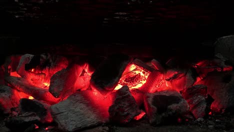 fire on coal in furnace made with bricks while grilling | close shot