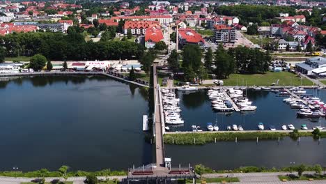 gizycko township and small marina with boats and yachts, aerial view