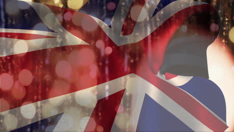 union jack flag with bokeh lights animation over silhouette of person