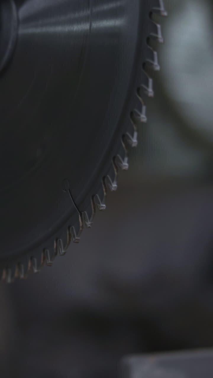 Rotating Circular Blade Closeup With Blurred Background, Sharp Teeth Catching Light, Metallic Sheen. Media