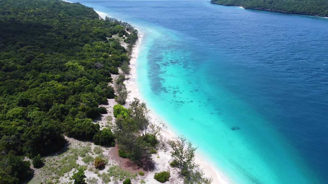 Static aerial view of remote Jaco Island with white sandy beach and turquoise ocean water in Timor-Leste, Southeast Asia